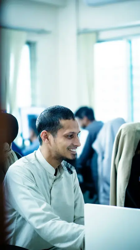 Support specialist working at a desk in a bright office