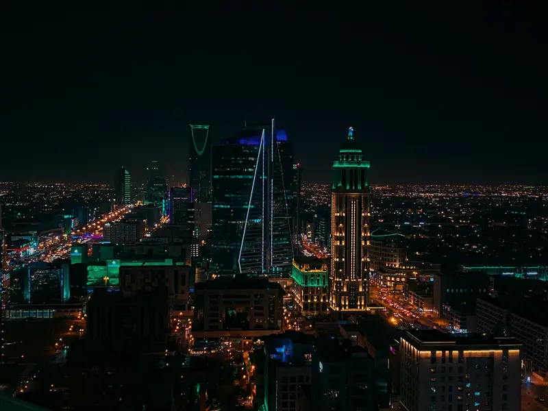 Riyadh skyline at night with lit towers and highways